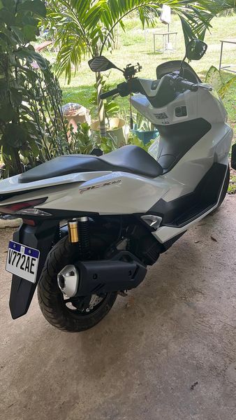 Honda PCX 160 in white, rear three-quarter view