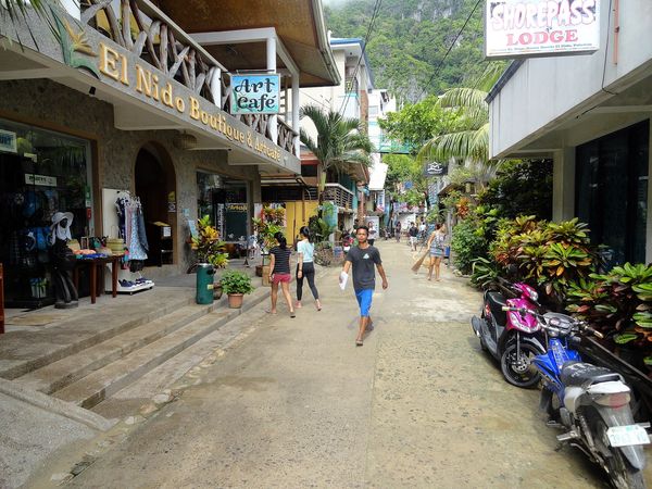 Art Cafe sign above the main street in El Nido town