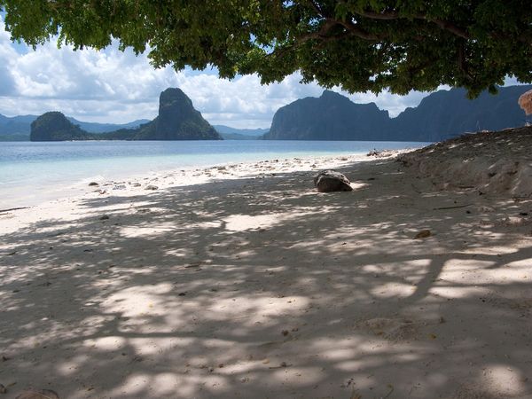 Shaded sand at Corong-Corong looking out over Bacuit Bay