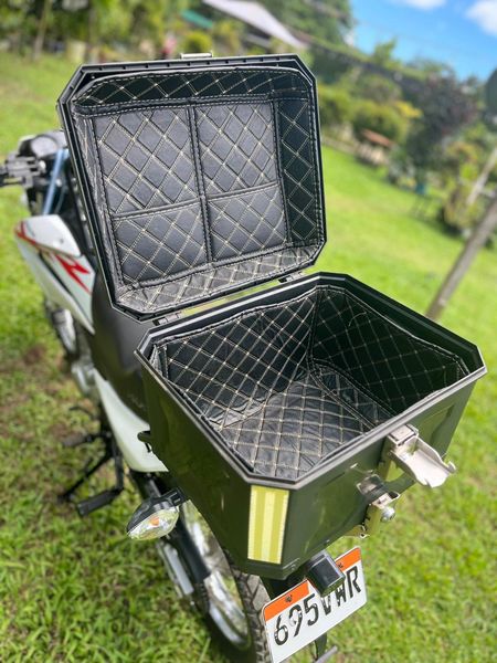 Lined top box open on a Honda XR 150