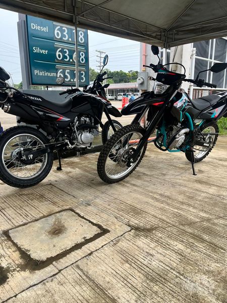Yamaha WR 155 and Honda XR 150 at a petrol station