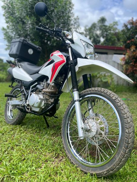 Honda XR 150 in white with a top box fitted