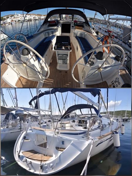 Cockpit and stern of the sailing yacht, with twin steering wheels and teak deck
