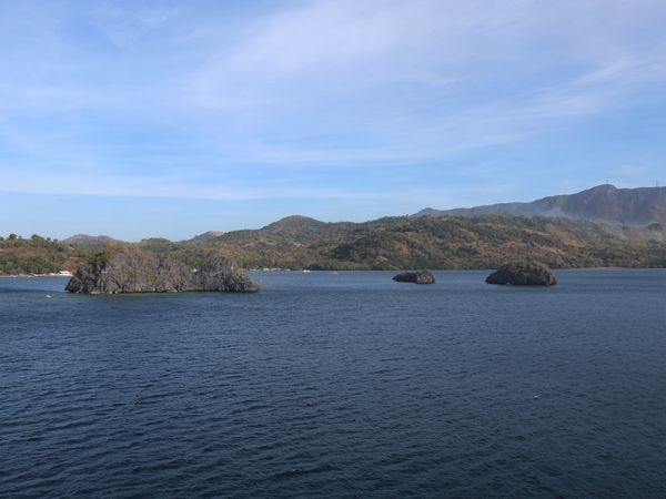 The Siete Pecados islets in Coron Bay seen from the water on a clear day